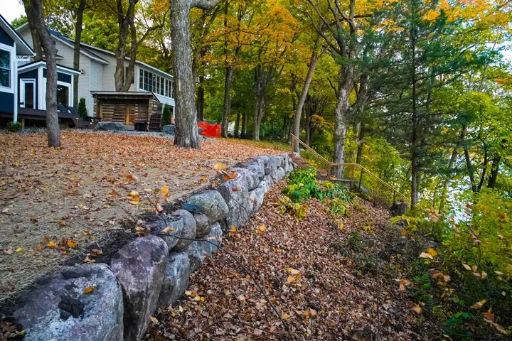 Cabin Landscaping with Boulder Walls, Flagstone Patio, and a New Driveway on Lake Washington, another view
